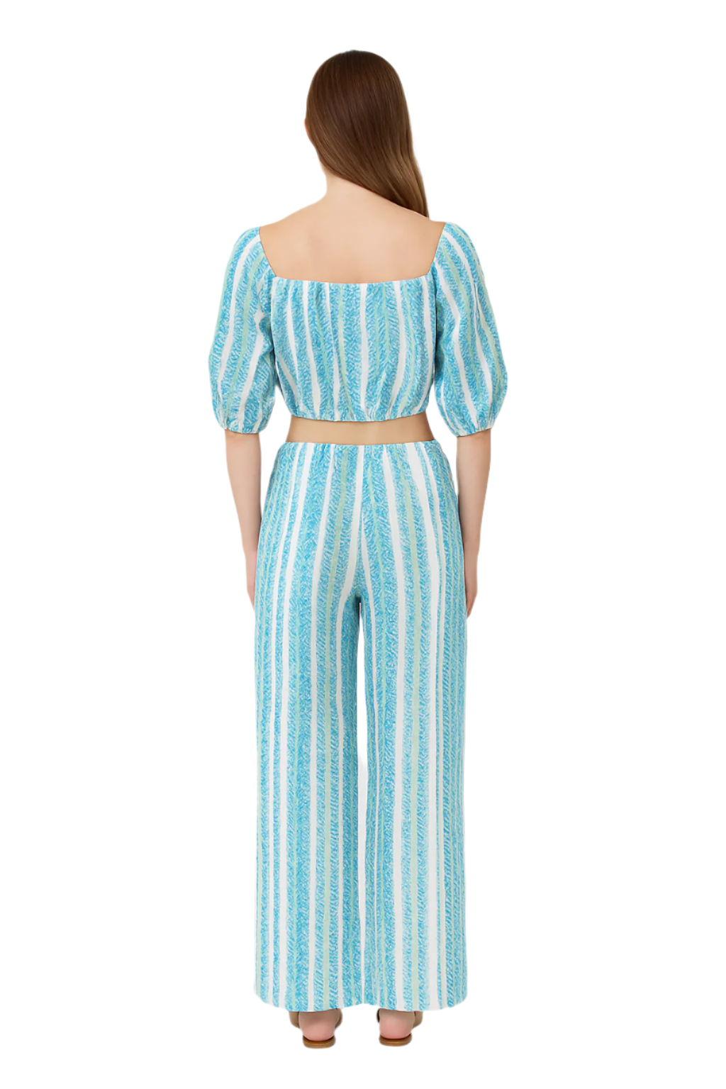 Woman wearing a blue and white striped outfit on a white background