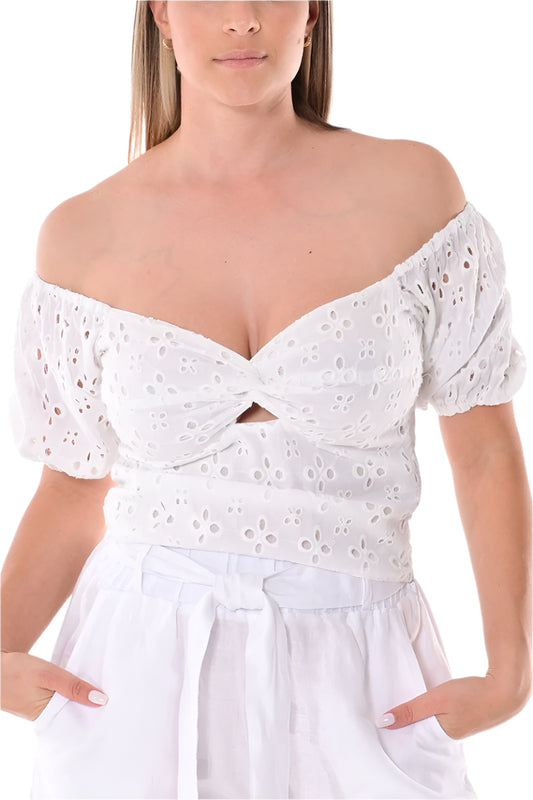 White off-shoulder top worn by a model on a white background