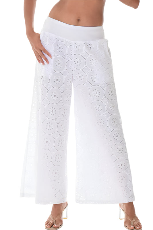 A pair of white, long length, embroidered cotton pants with front pockets and a wide waistband.
