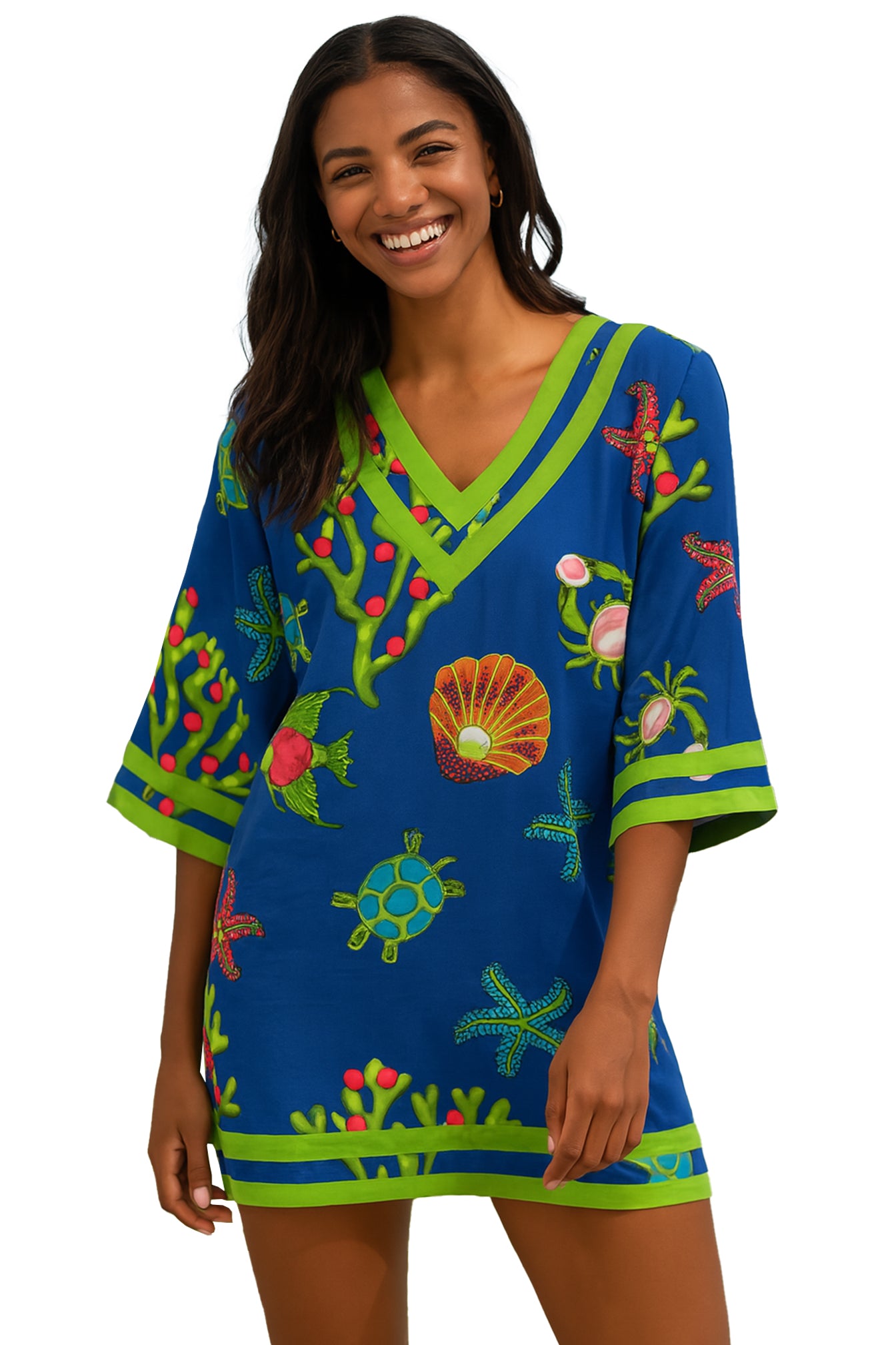 Woman wearing a colorful tropical-themed dress with a white background